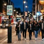 London night-time street near bars and student venues, illustrating Met Police spiking safety warning for Freshers' Week
